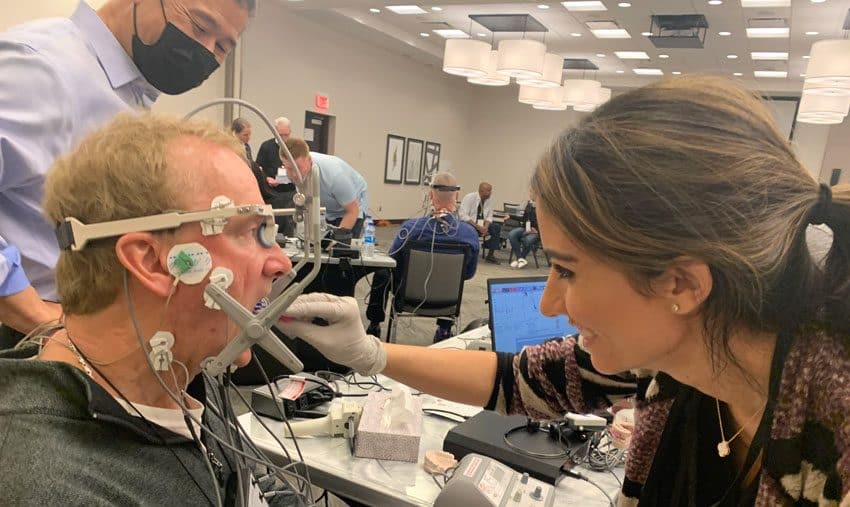 Dr. Michael Miyasaki coaches dentists on K-7 jaw tracking analysis and bite impressions at a Myotronics seminar in Chicago.