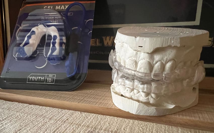gel max mouth oral appliance along side a mold of a bite